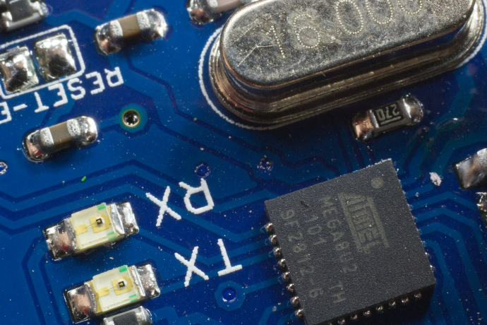 close photo of blue circuit board